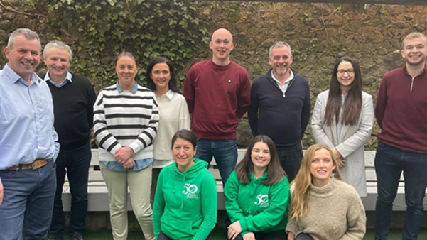 MindaClient team staff group photo at outdoor corporate event