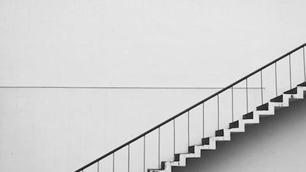 Modern office building staircase representing corporate growth and progress