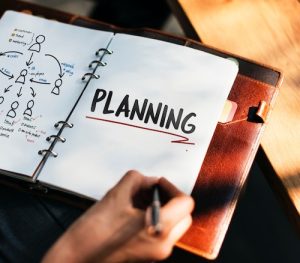 Open notebook with planning written on page for business strategy