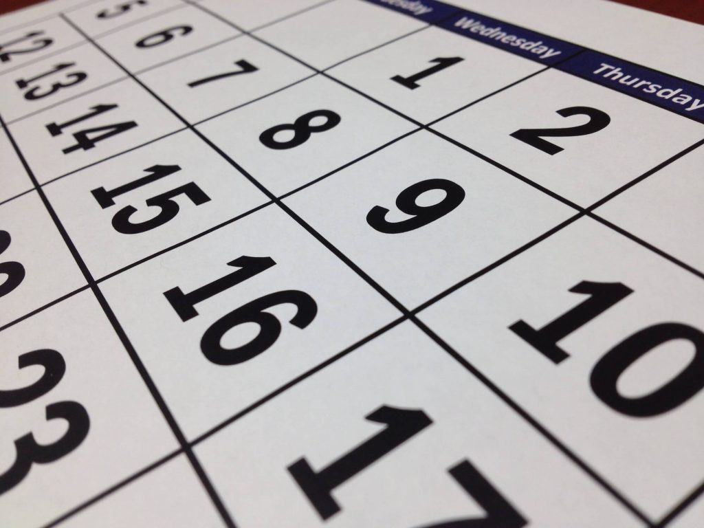 Close-up of calendar page representing scheduling and time management