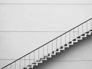 Modern office building staircase representing business growth