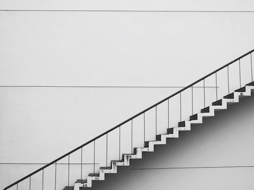 Modern office building staircase representing business growth