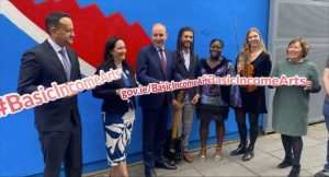 MindaClient team celebrating at corporate event with red banner