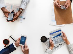Business professional using smartphone for mobile CRM access