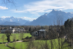 Scenic green mountain valley landscape with clear sky